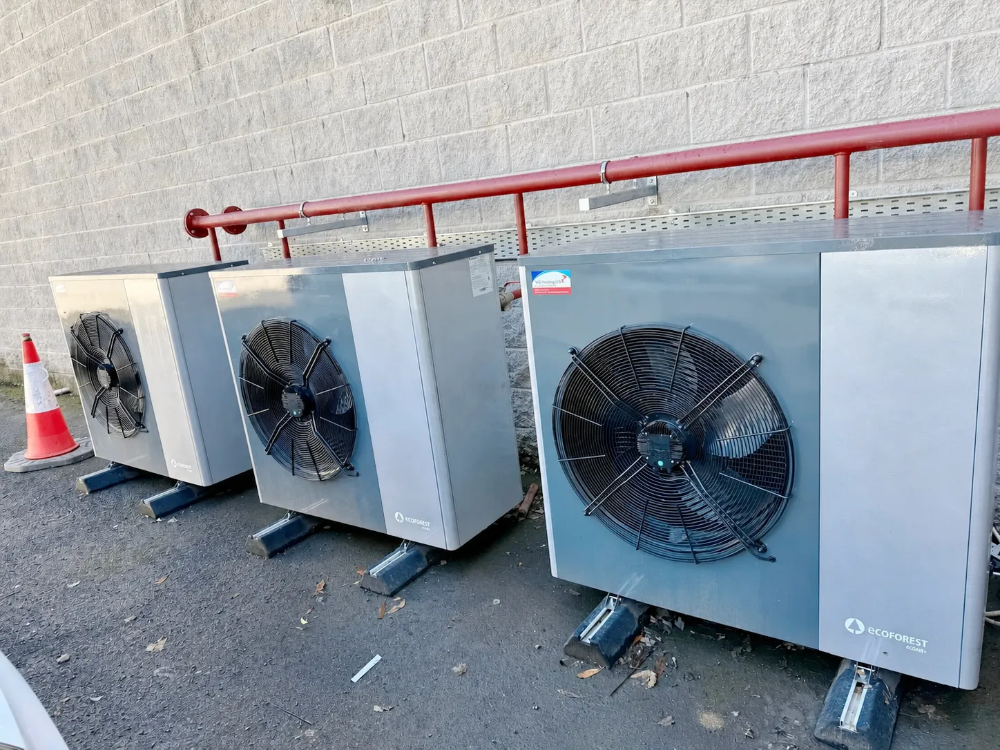 Bank of Ecoforest commercial heat pumps outside a business premises